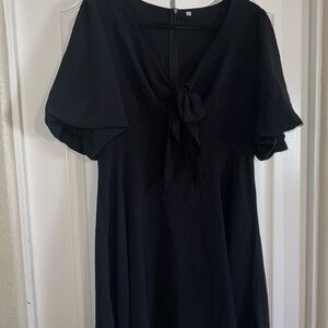 Elegant Black Dress with Bow Detail